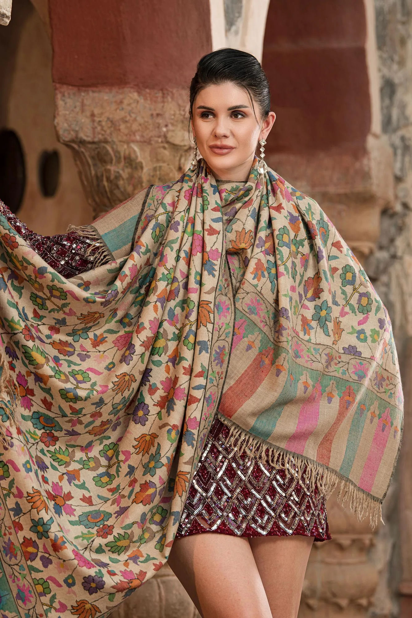 Floral kani shawl draped by a model