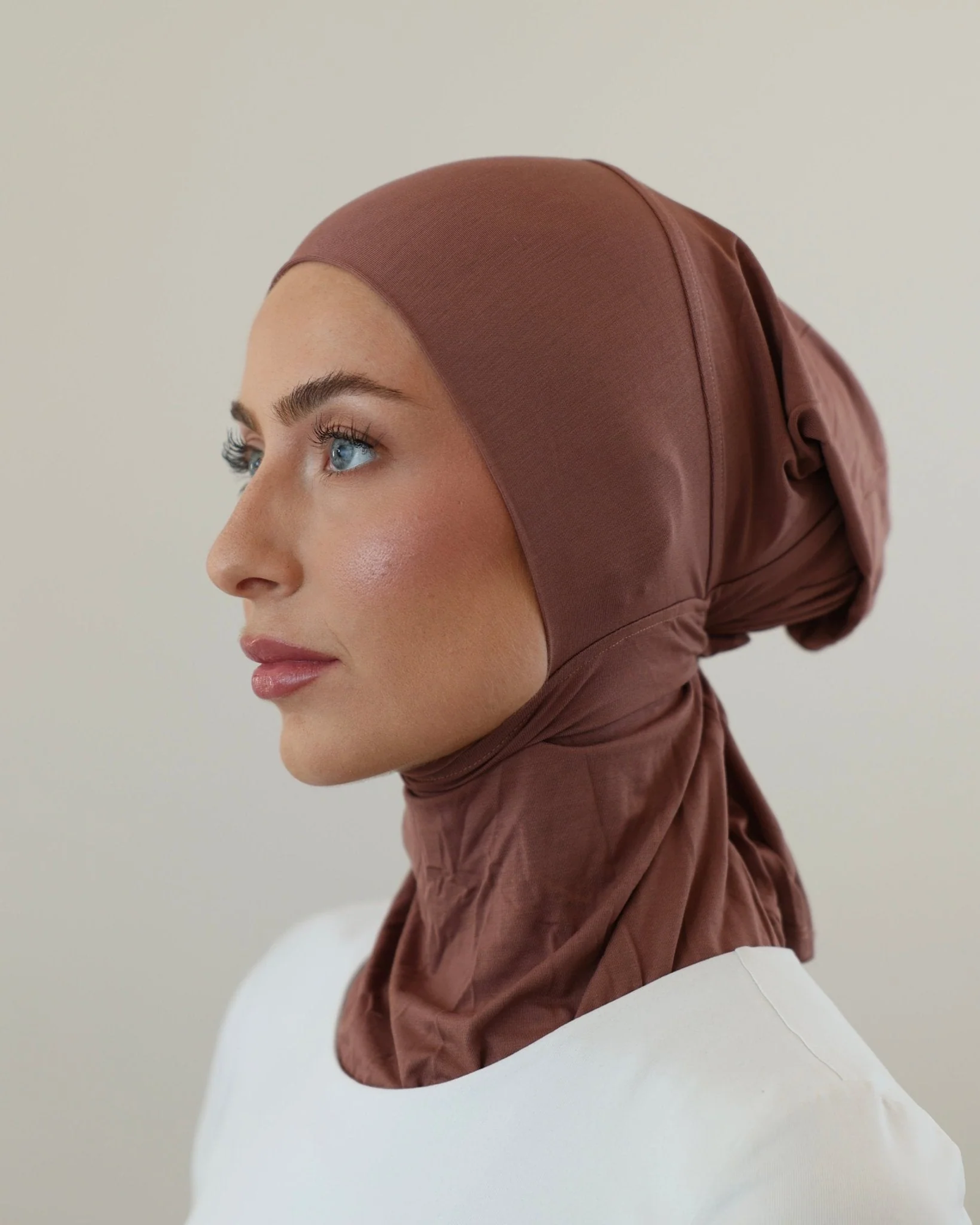 Rust-toned inner hijab cap side profile