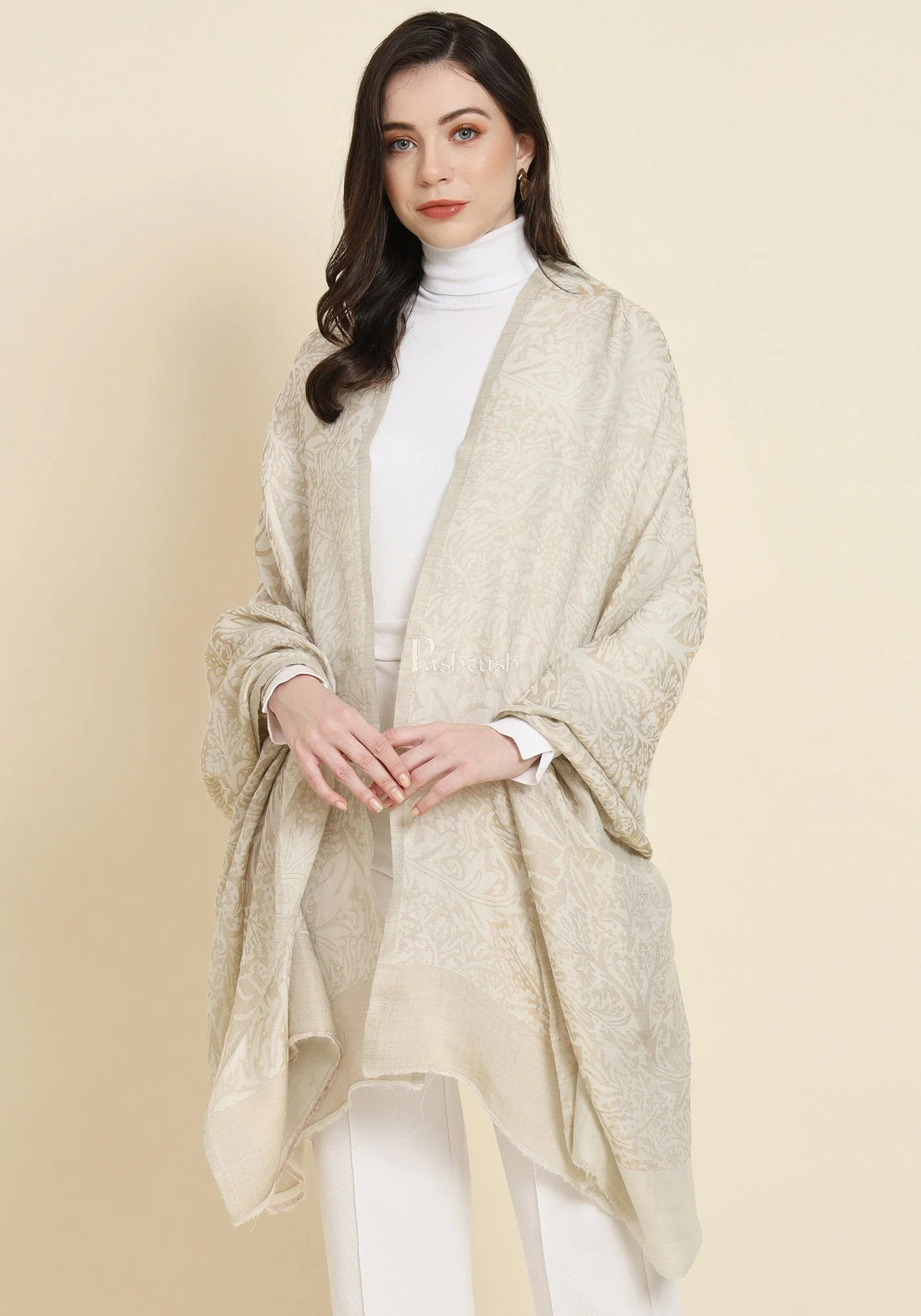Model in an ivory hand-woven pashmina shawl