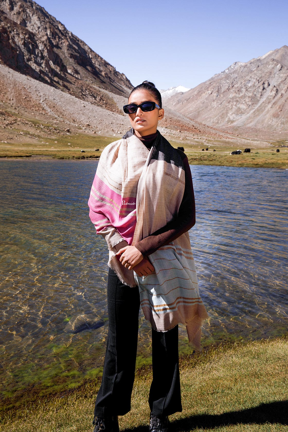 Woman wearing a striped pashmina wrap in an outdoor lifestyle shot