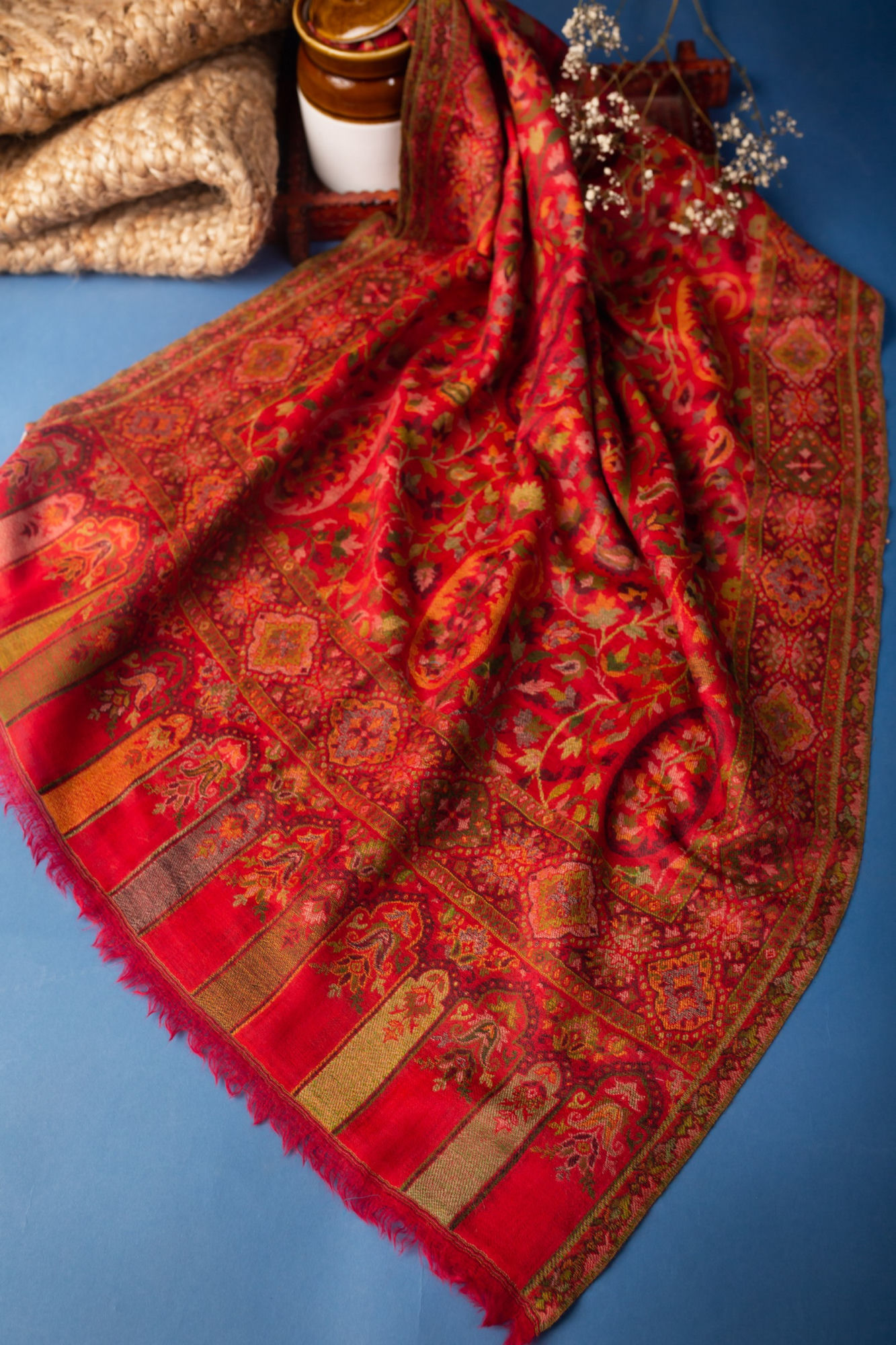 Kashmiri-style red paisley shawl with intricate woven detail